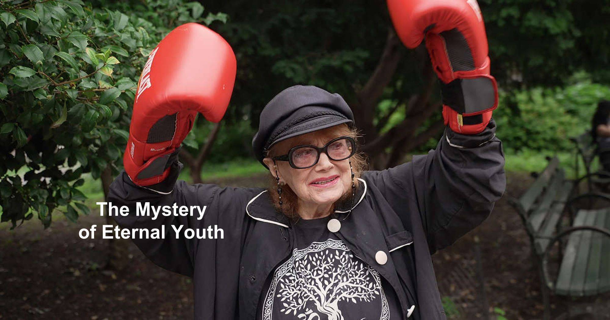 Old woman with boxing gloves symbolizing healthy aging